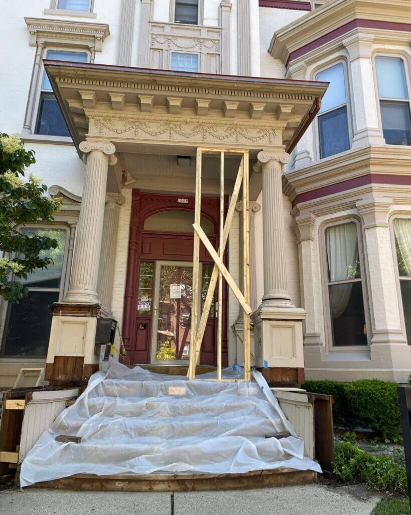The middle of the porch restoration project. wooden beams are added for structure.