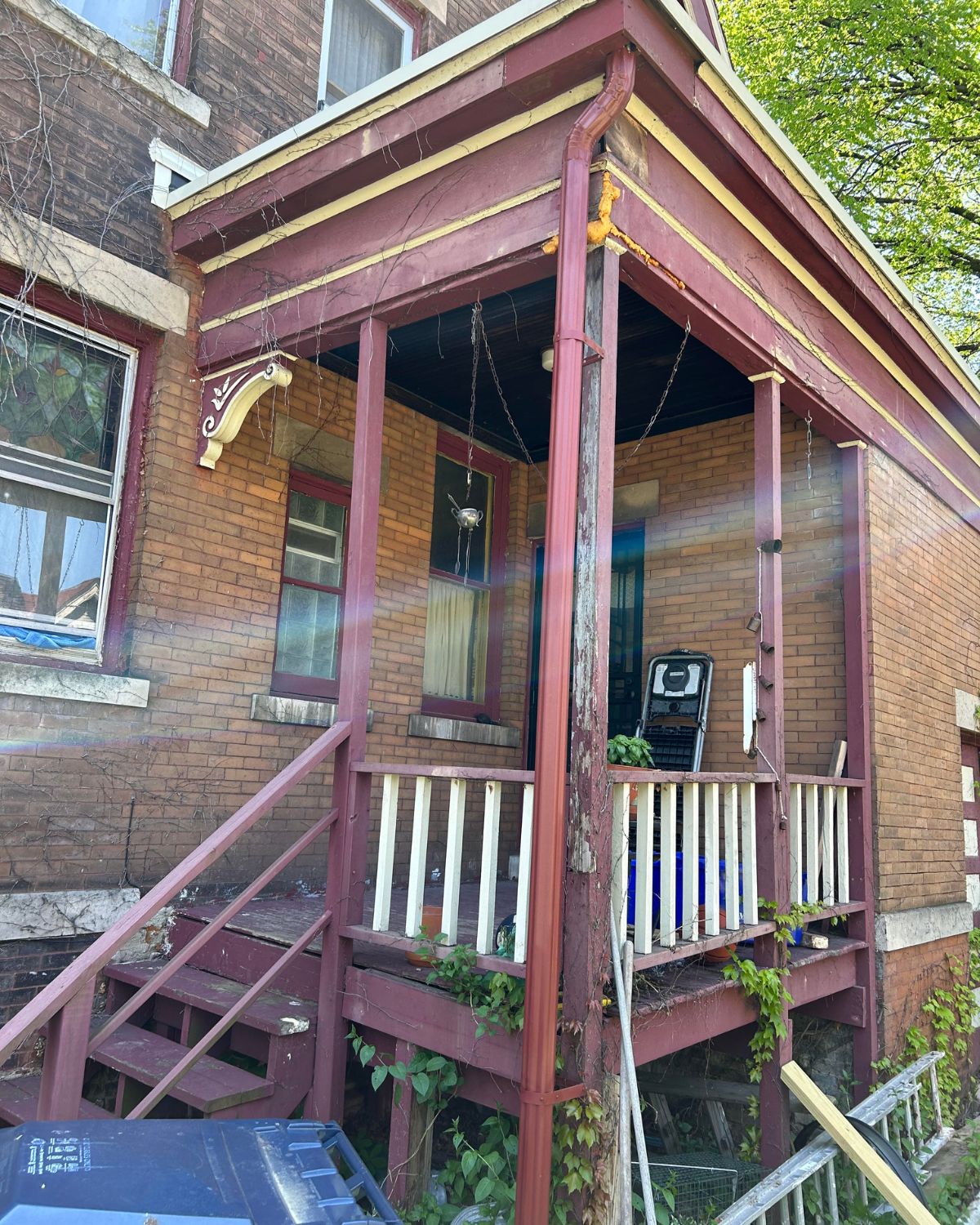 The before of a back porch restoration from 1915