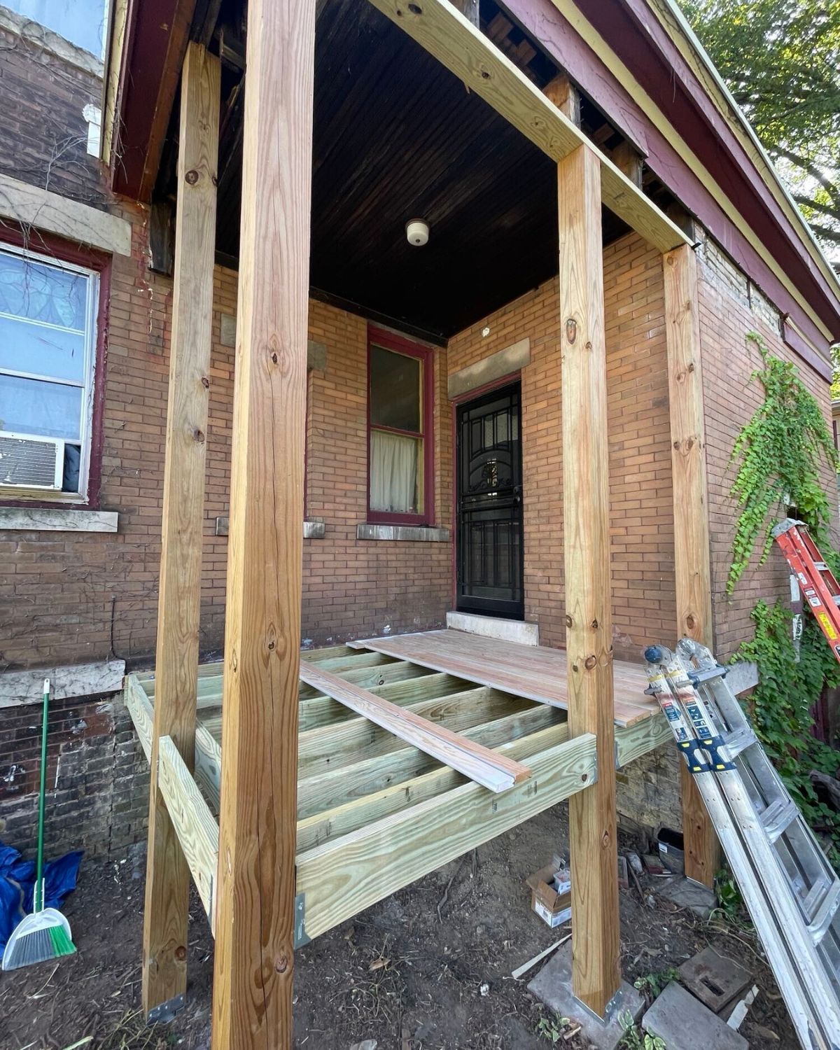 The during of a back porch restoration from 1915
